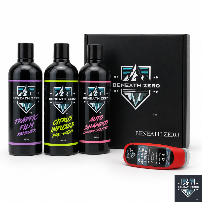 A Beneath Zero car care gift set featuring three black bottles of shampoo and wash liquids with purple, green, and pink labels, a black branded box, and a red-and-black oil cleaning bottle on a white background.
