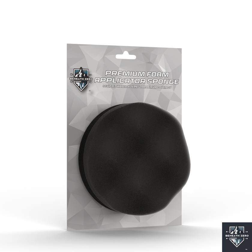 Black foam applicator sponge in packaging on a white background