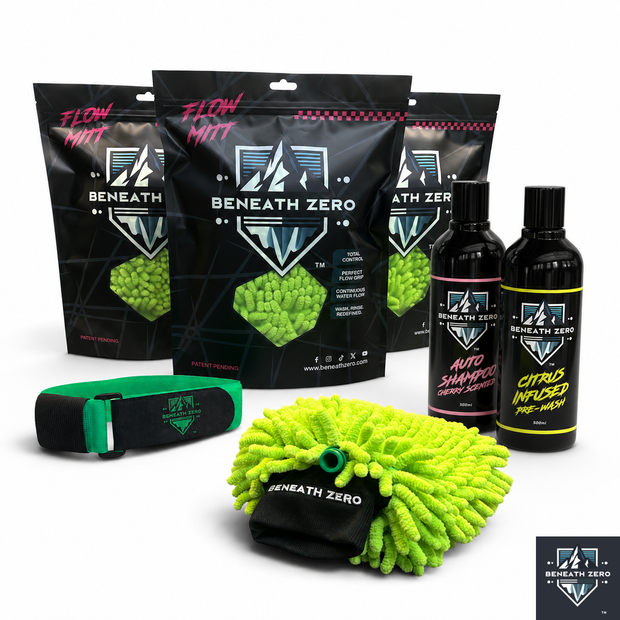 A car care kit from Beneath Zero, featuring three black Flow Mitt pouches, a green and black microfiber mitt, a green applicator strap, and two black bottles of Auto Shampoo and Citrus Infused Pre-Wash, arranged on a white background.