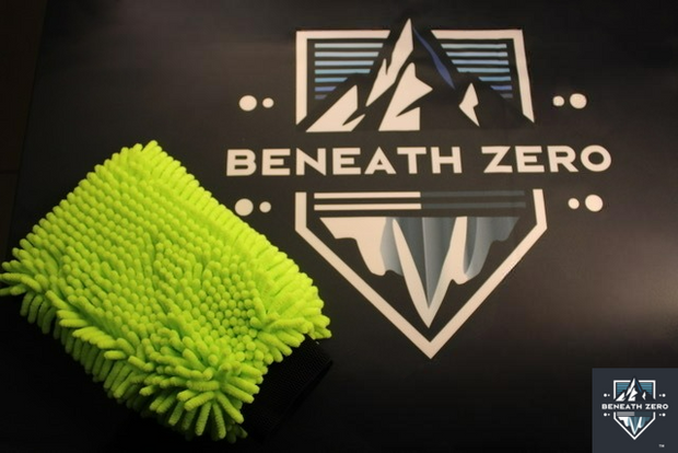 Green microfiber cloth next to 'Beneath Zero' logo on a dark background