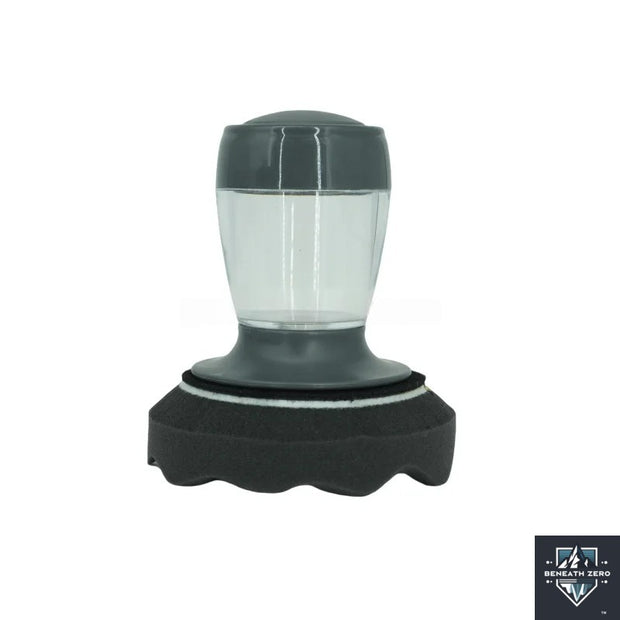 Black and gray tyre dressing applica with clear glass on a white backgroundor