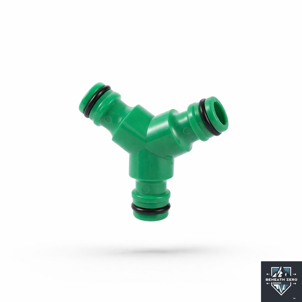 Green plastic hose fitting on a white background